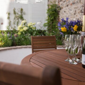 Garden in Sea Breeze Cottage and outdoor dining area