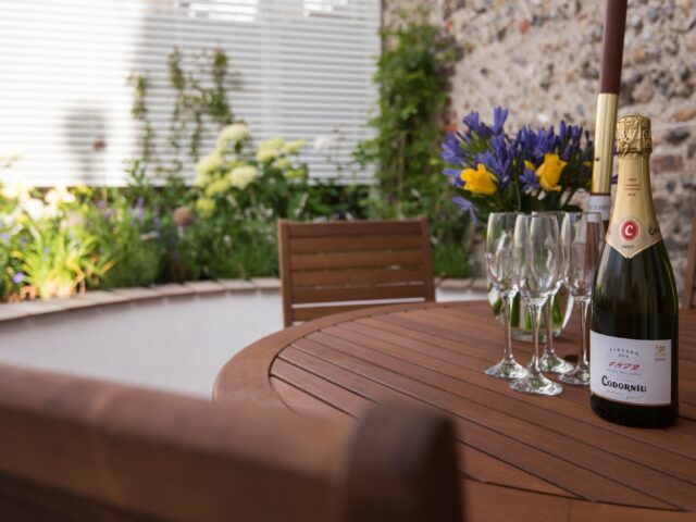 Garden in Sea Breeze Cottage and outdoor dining area