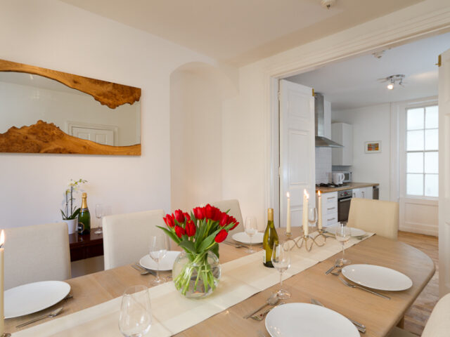 The dining room opening through to the kitchen